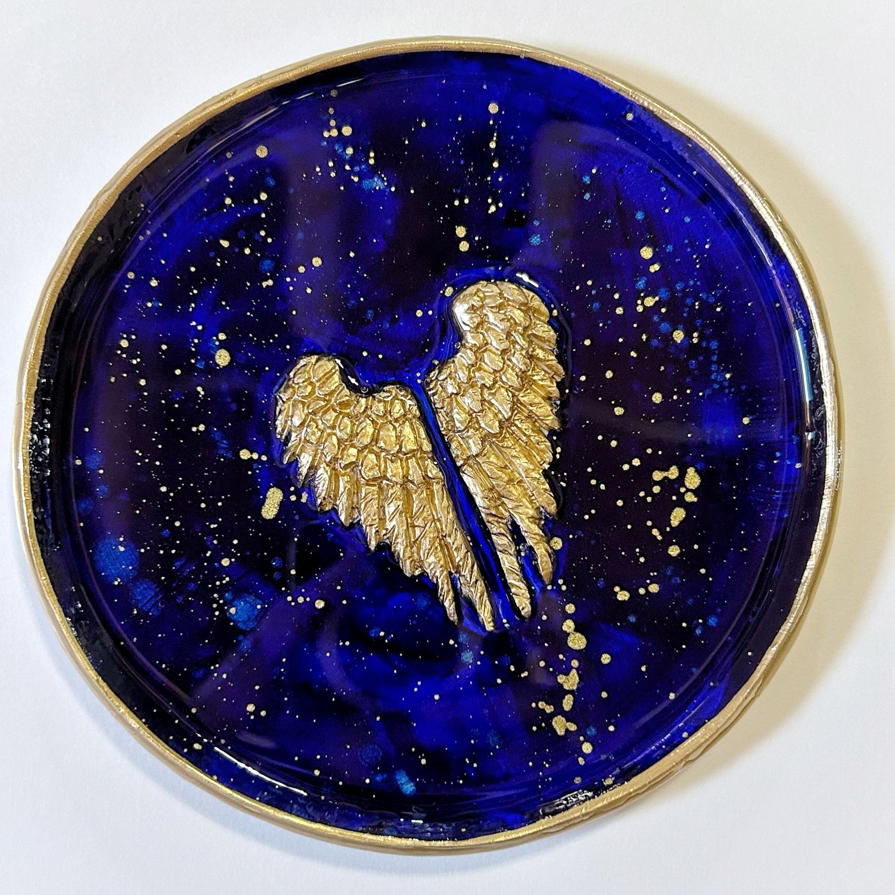 Gold angel wings on a blue ring dish - trinket tray - jewelry tray