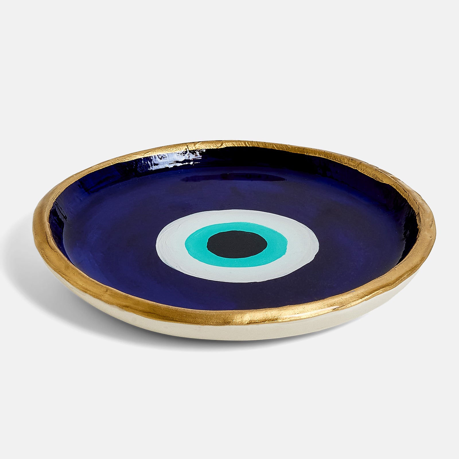 Decorative ring dish with a blue background and evil eye design